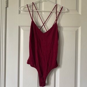 FASHION NOVA crisscross back bodysuit (size M)